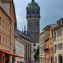In the pedestrian area of Wittenberg with the church of the castle
